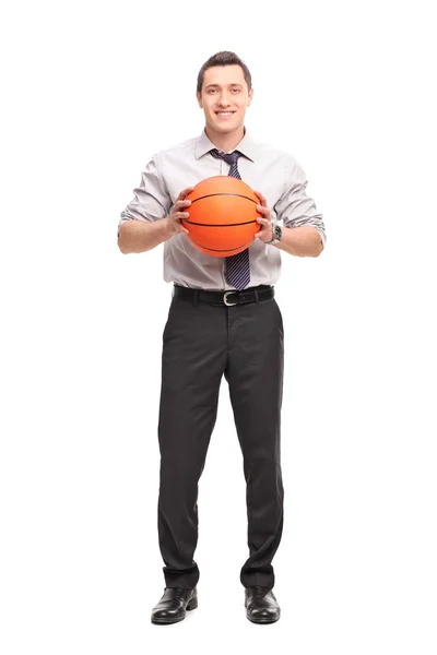 Young businessman holding a basketball — Stock Photo, Image
