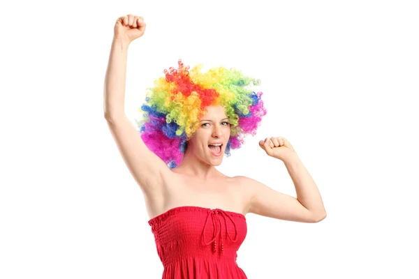 Woman with a wig gesturing joy — Stock Photo, Image