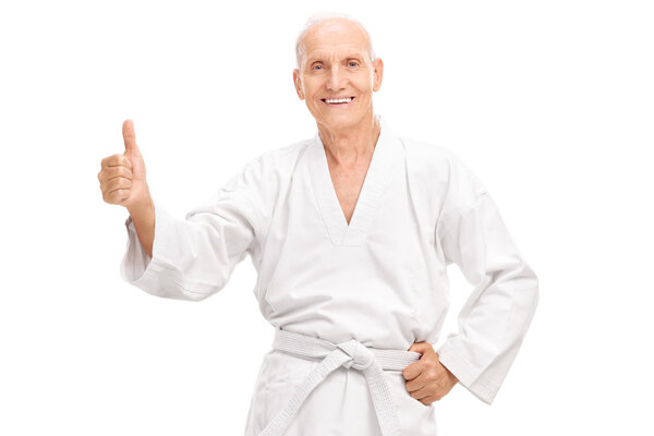 Senior man in kimono giving a thumb up