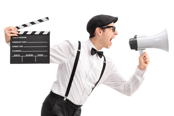 movie director holding a clapperboard and shouting