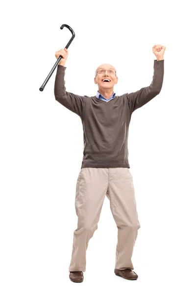 Overjoyed senior man holding a cane — Stock Photo, Image