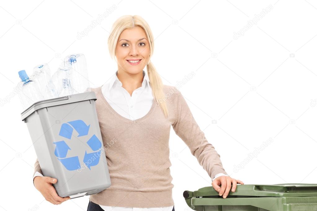 Woman holding a recycle bin
