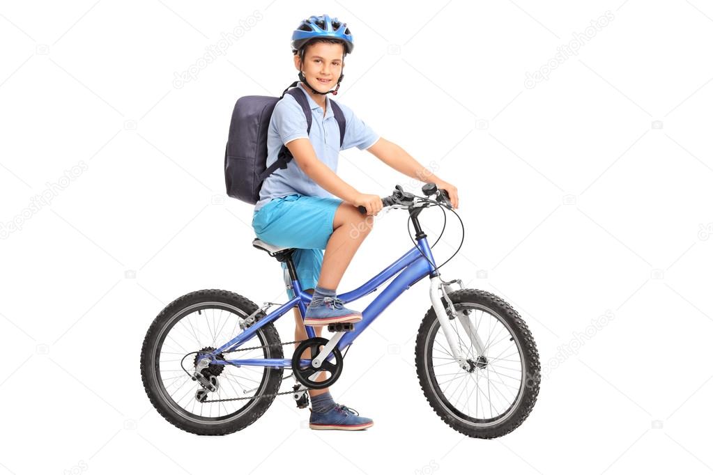 schoolboy riding a bicycle