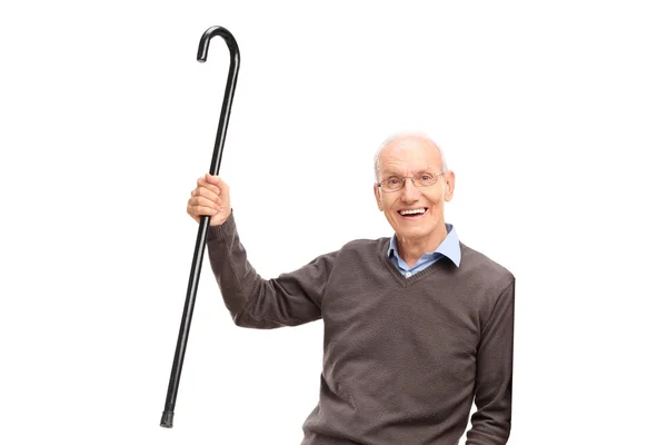 Caballero mayor mostrando su bastón —  Fotos de Stock
