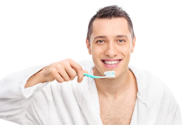 Man holding a toothbrush — Stock Photo, Image