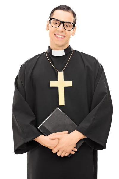 Priest holding the holy bible — Stock Photo, Image