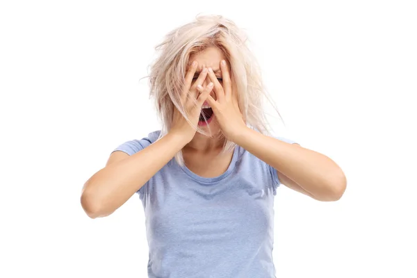 Woman holding her hands on her head — Stock Photo, Image