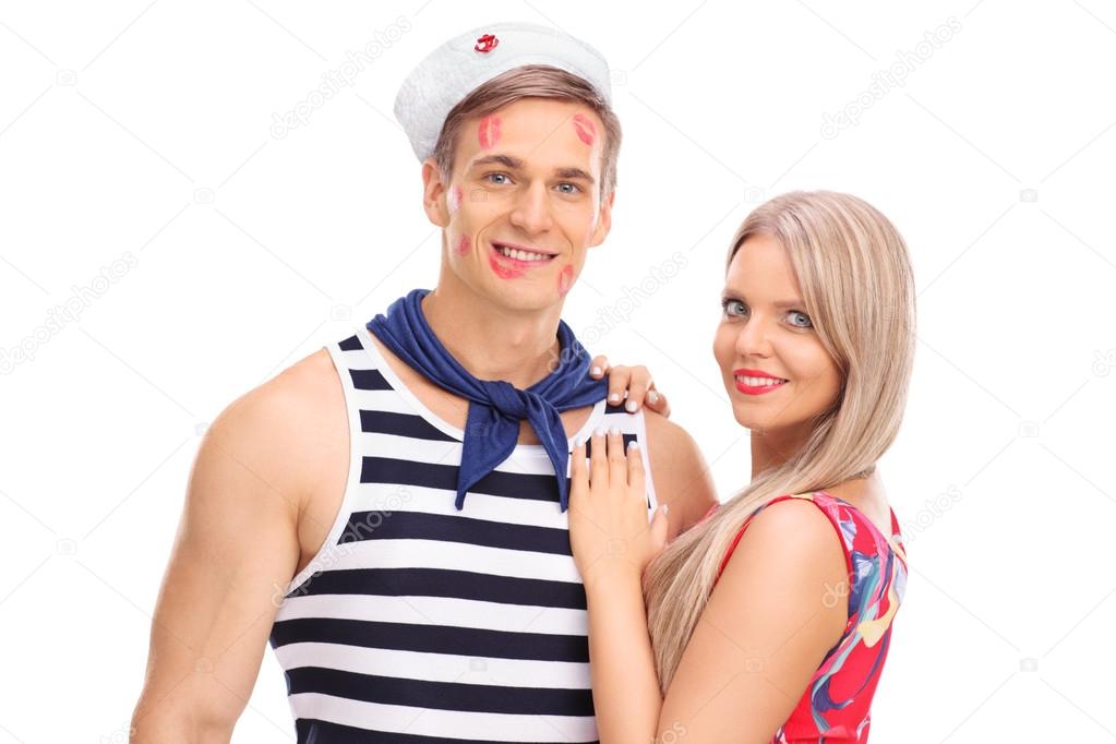 Young woman posing with sailor boyfriend