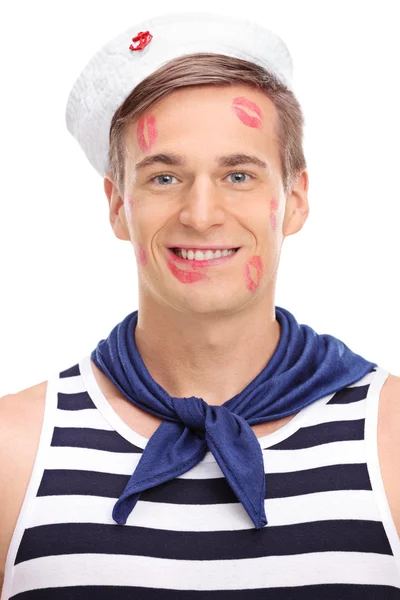 Sailor covered in lipstick kiss marks — Stock Photo, Image