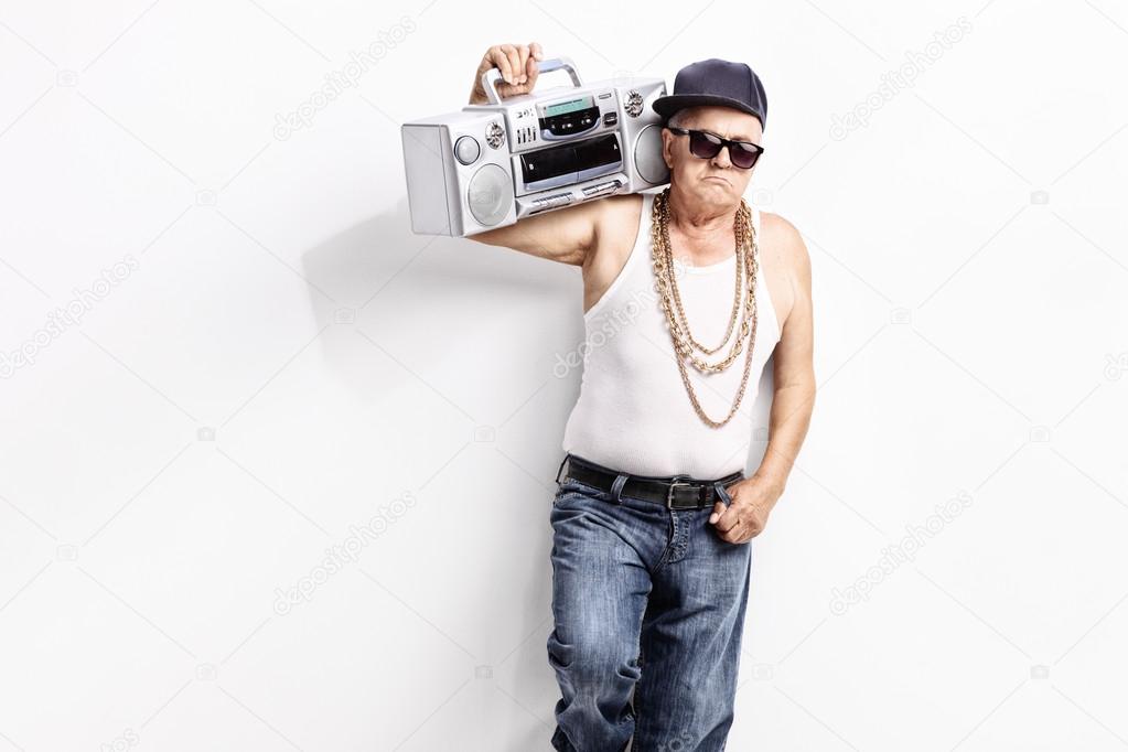 Senior rapper carrying a ghetto blaster