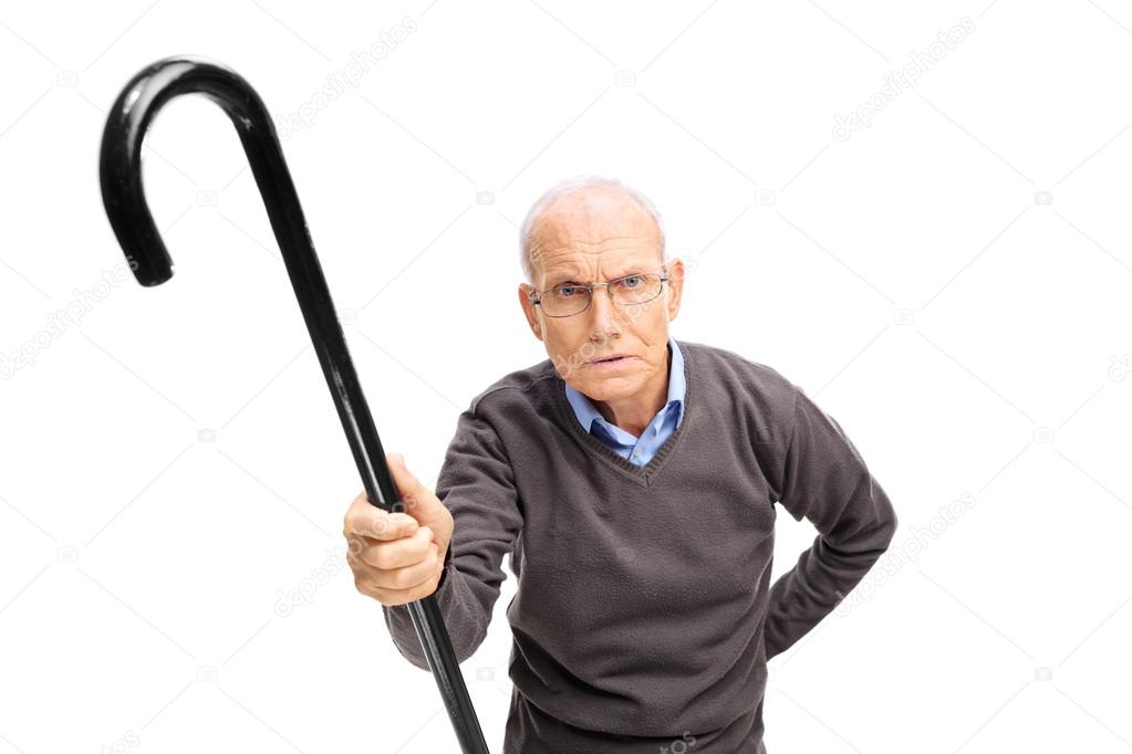 Displeased senior man scolding someone