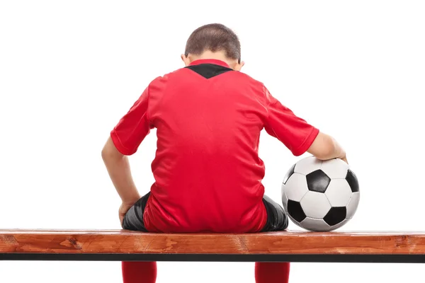 Triste niño en jersey de fútbol rojo —  Fotos de Stock