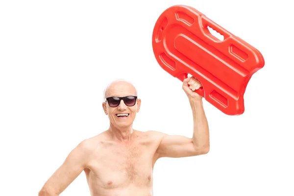 Senior man holding a swimming float — Stock Photo, Image