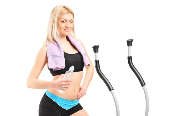 Woman on a cross trainer machine — Stock Photo, Image