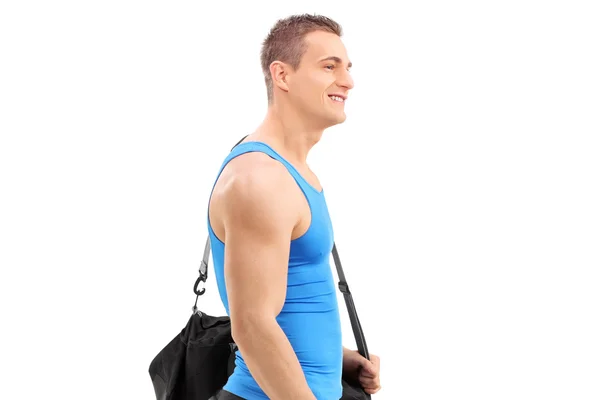 Young athlete carrying sports bag — Stock Photo, Image