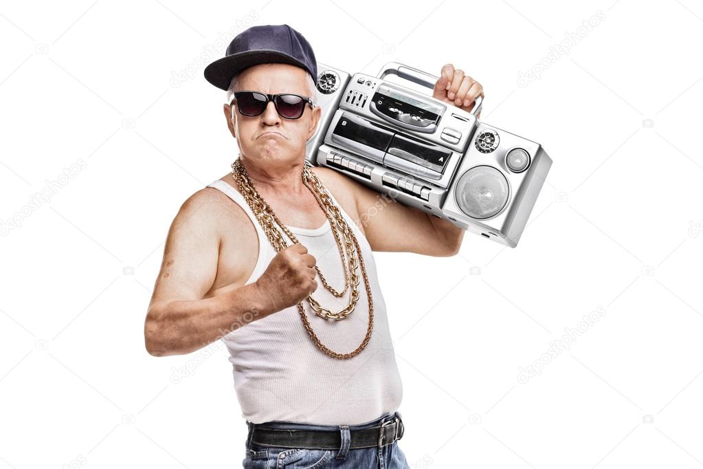 Mature man holding a ghetto blaster Stock Photo by ©ljsphotography 82322280