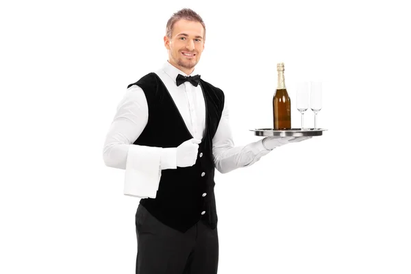 Waiter holding a tray with a champagne — Stock Photo, Image