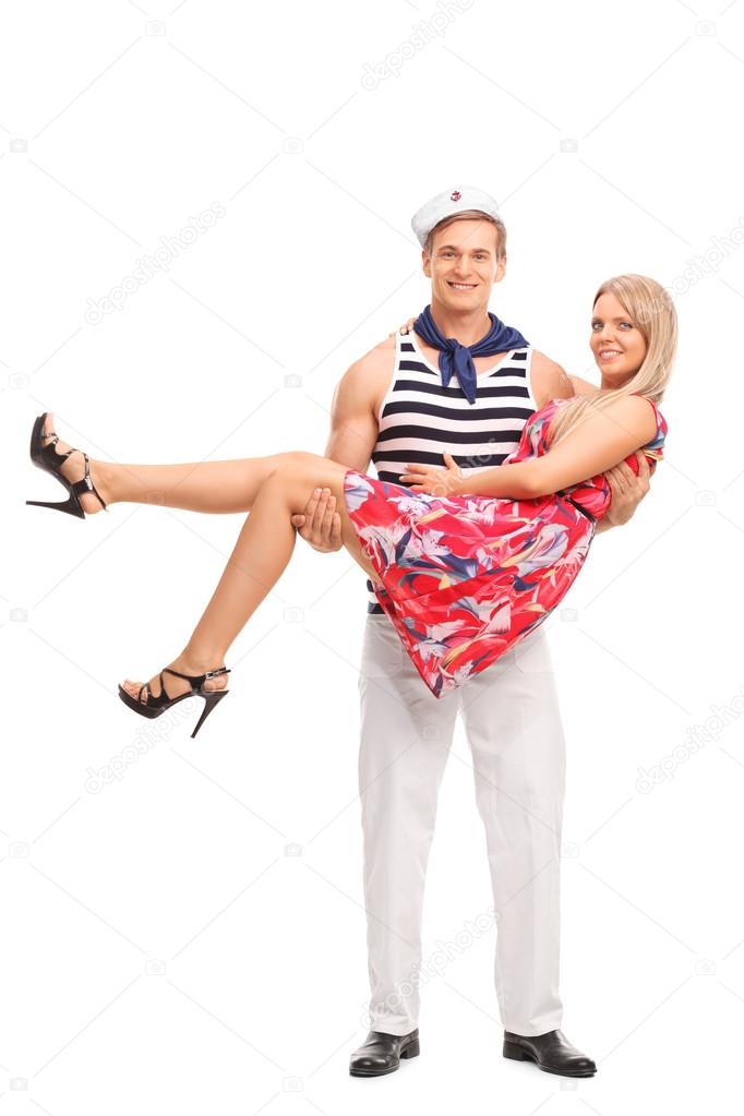 male sailor carrying his girlfriend
