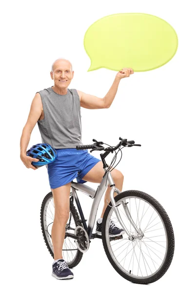 Starszy mężczyzna siedzi na rowerze — Zdjęcie stockowe