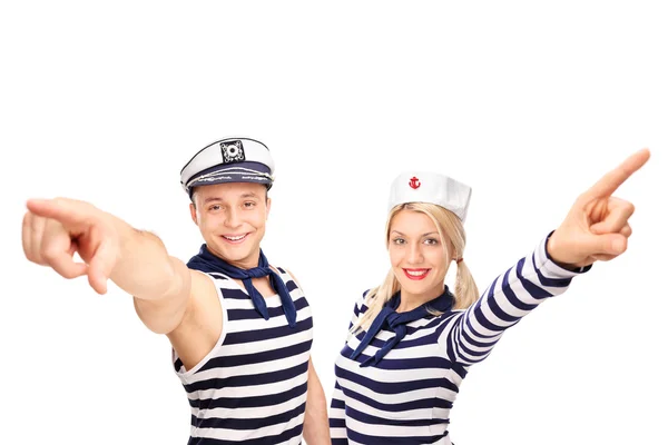 Male and female sailor pointing up — Stock Photo, Image