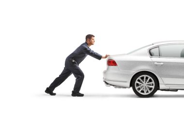 Auto mechanic pushing a car isolated on white background