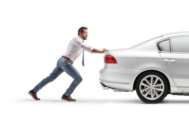 Full length profile shot of a man pushing a car isolated on white background