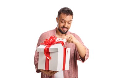 Excited young man opening a present box isolated on white background