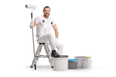 Painter sitting on a ladder with a paint roller and buckets isolated on white background
