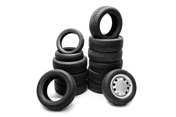Car tires piled up in two stacks — Stock Fotó