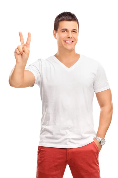 Man making a peace hand gesture — Stockfoto