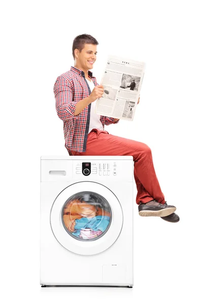 Man waiting for the washing machine to finish — Stock Photo, Image