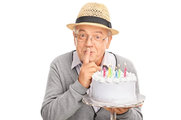 Senior gentleman carrying a birthday cake — Stock Photo, Image