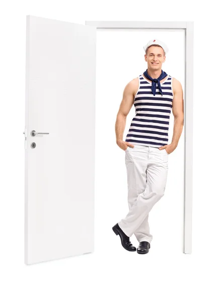 Sailor leaning against open door — Stock Photo, Image