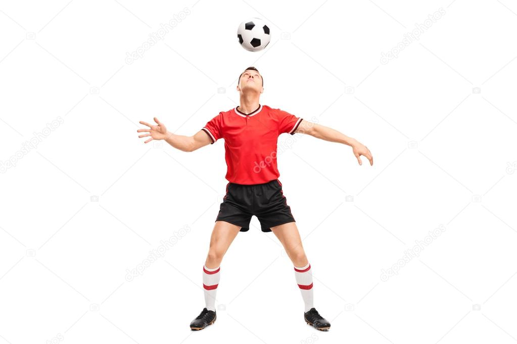 Football player juggling a ball on head