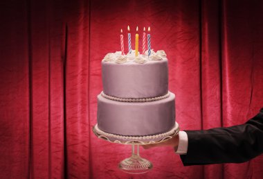 male hand holding a birthday cake clipart