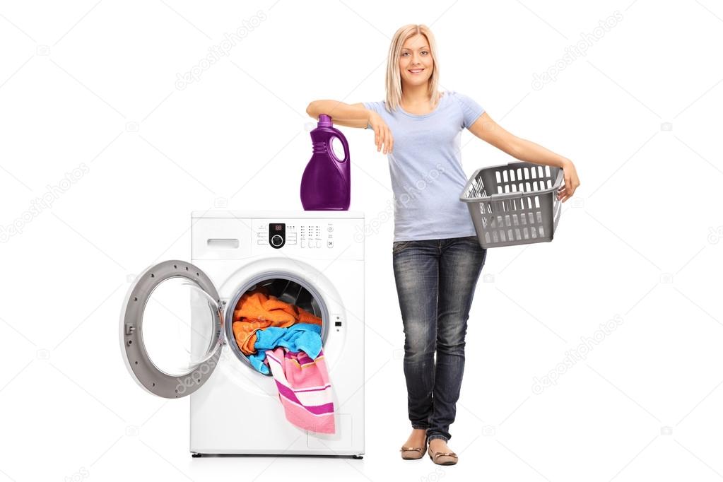 Woman leaning on a washing machine