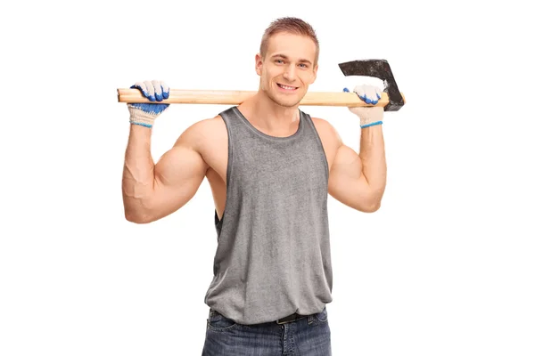 Handsome young logger carrying an axe — Stock Photo, Image