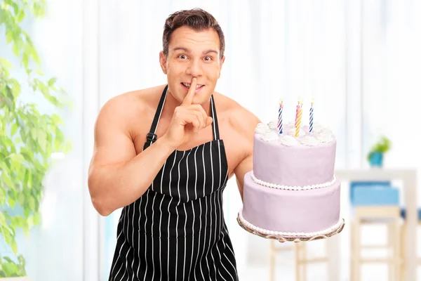 Naked man holding a birthday cake — 스톡 사진