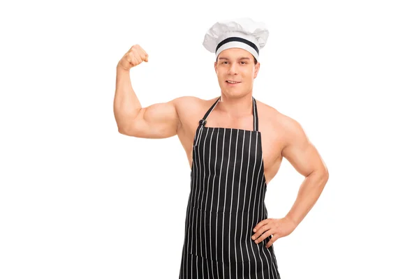 Naked chef with apron showing biceps — Stock Photo, Image