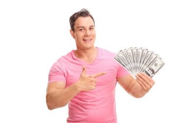 Young man holding a stack of money