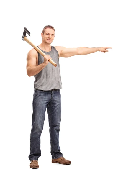 Man carrying an axe and pointing — Stock Photo, Image