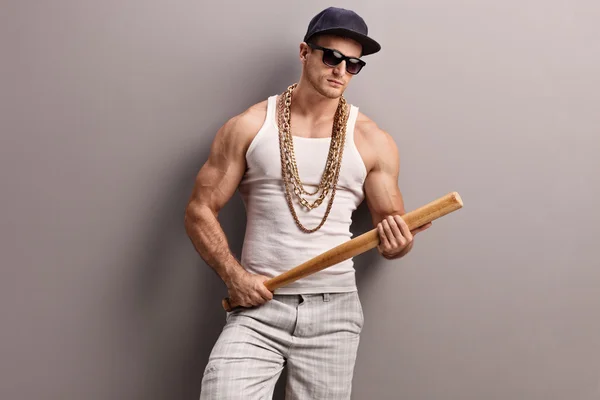 Muscular gangster holding a baseball bat — Stock Photo, Image