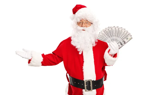 Santa Claus sosteniendo un spread de dinero — Foto de Stock