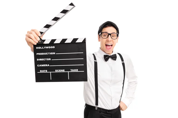 Excited movie director holding a clapperboard — Stock Photo, Image