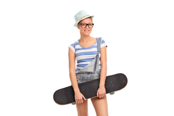 Alternative girl holding a skateboard — Stockfoto