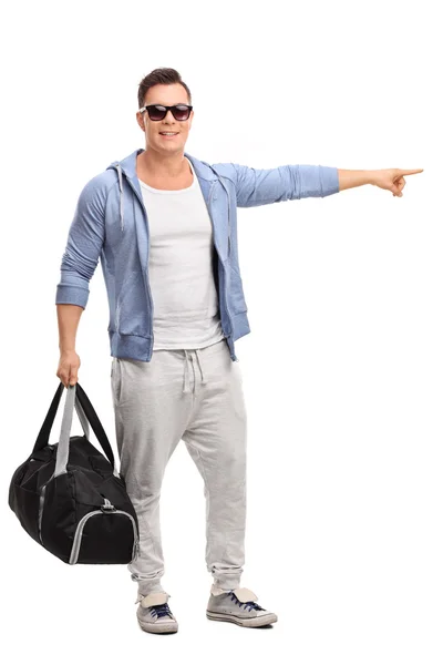 Man in sportswear holding a sports bag — Stok fotoğraf