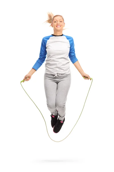 Young girl exercising with skipping rope — Stock Photo, Image