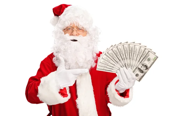 Santa Claus holding money Stock Picture