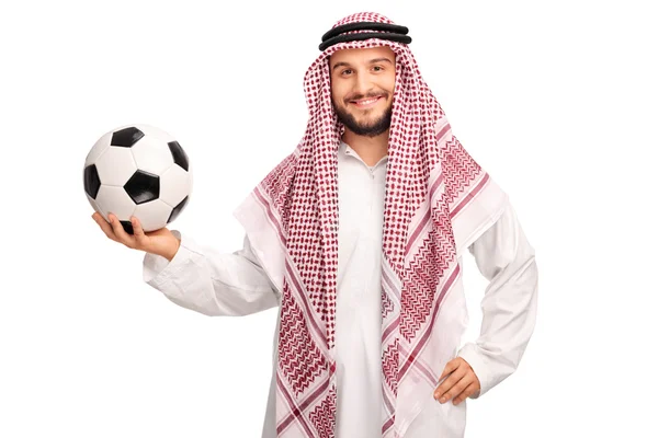 Jovem árabe masculino segurando uma bola de futebol — Fotografia de Stock