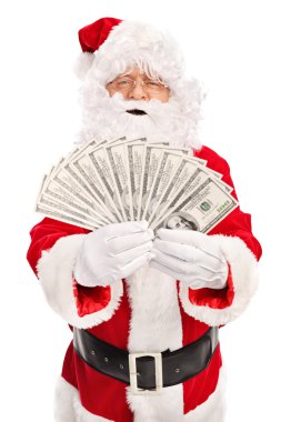Santa Claus spreading a stack of money